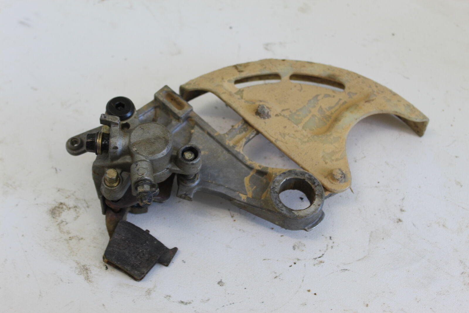 04-07 HONDA CRF450R CRF 450 R REAR BACK BRAKE CALIPER W/ HANGER BRACKET MOUNT